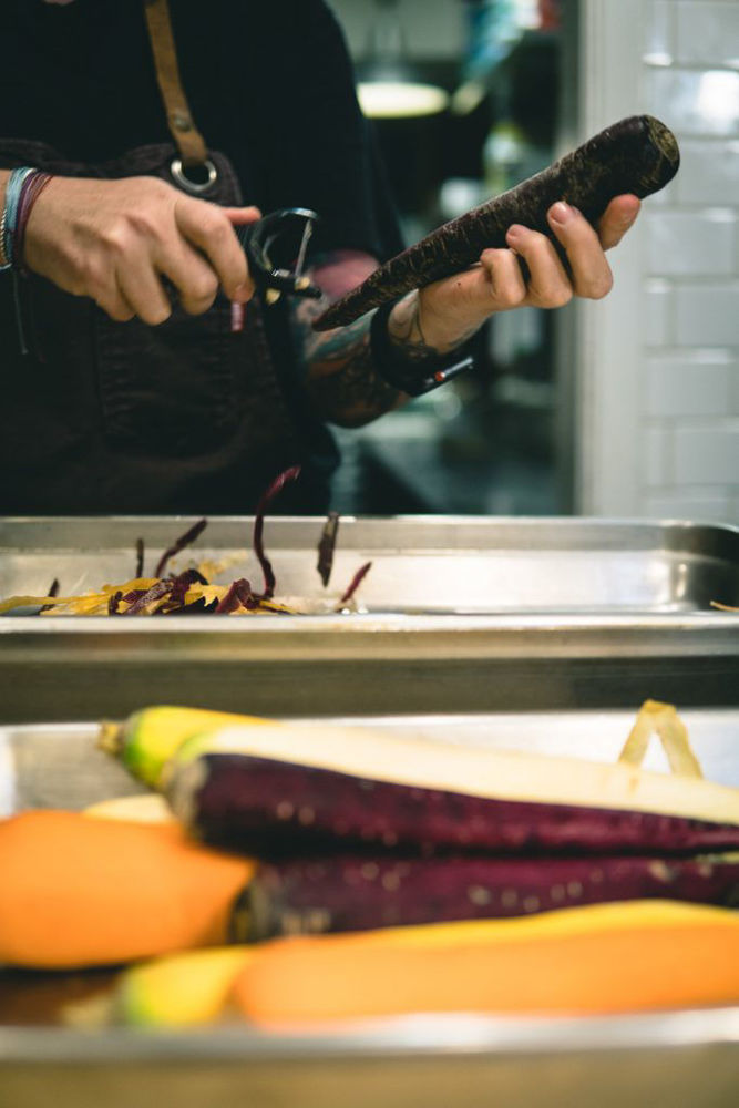 Peeling heirloom carrots from 100km Foods